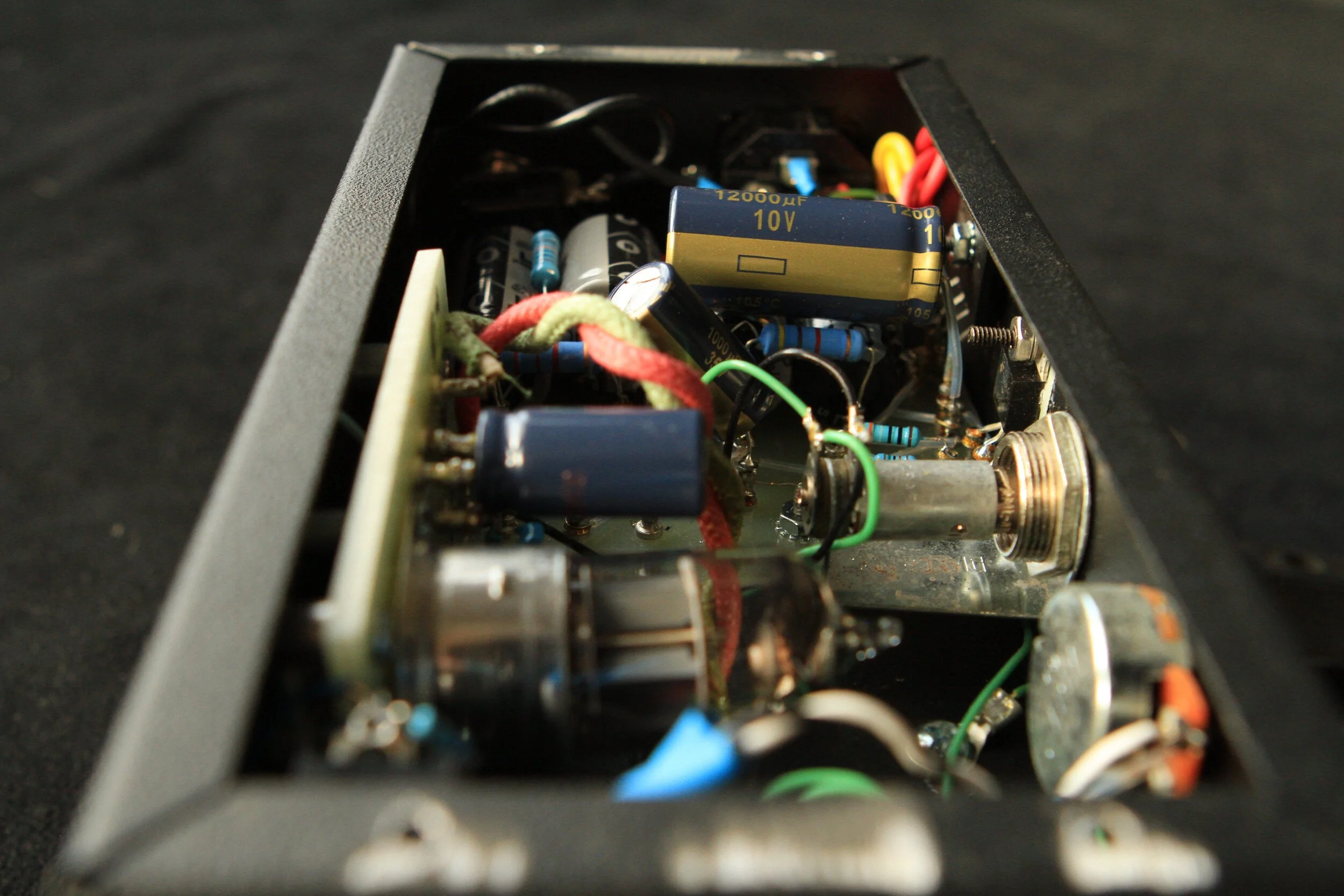  The build was on turret boards in the small Hammond enclosure. I cut the boards by hand, drill the holes for the turrets on a drill press, then press in the turrets using the drill press.  