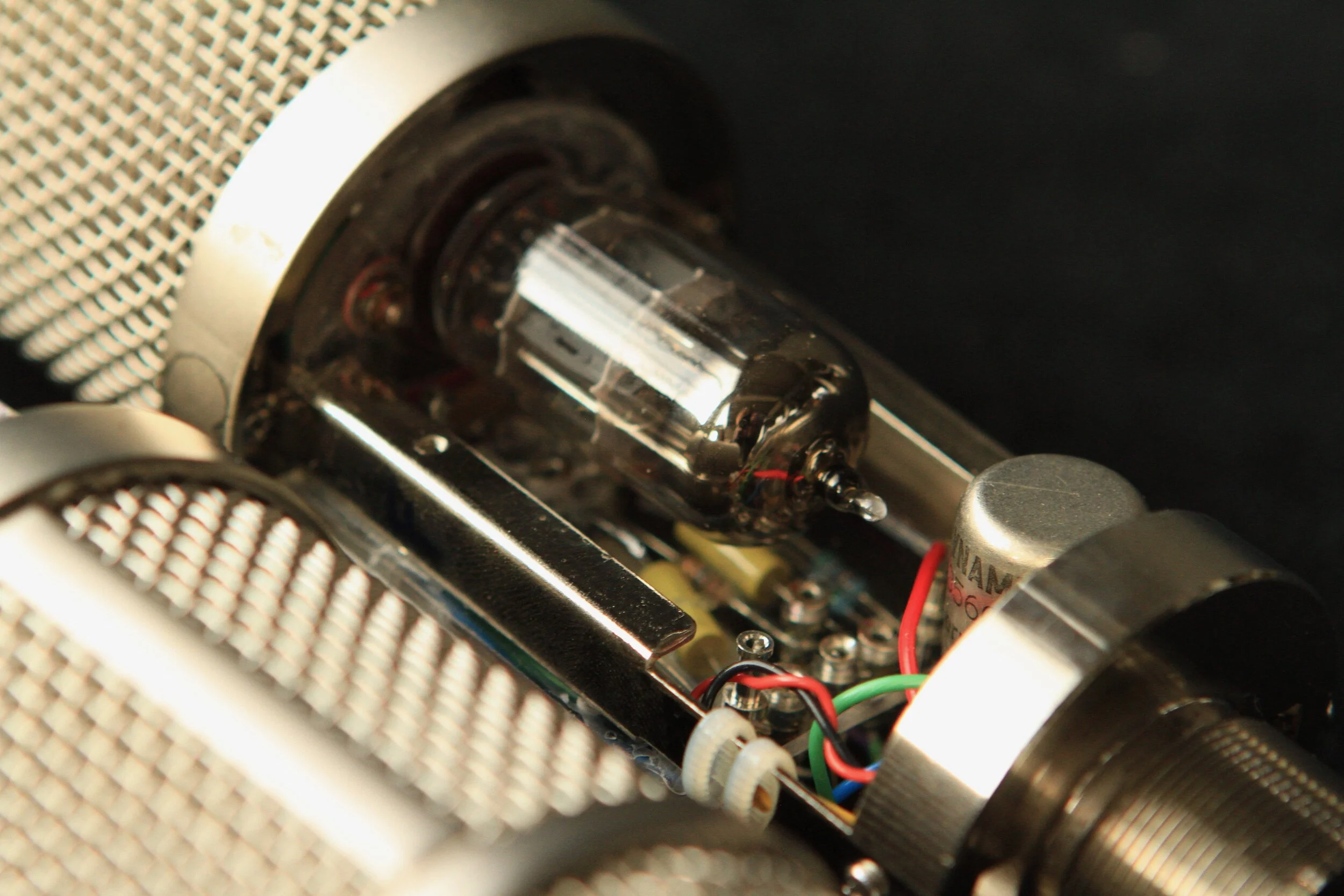  Because these mics use a cap bypassed cathode resistor and the heater current is not used in the audio side of the circuit (like it is in the U47), the required power supply is simpler.  